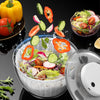 Essoreuse à salade électrique en plastique de grande capacité avec recharge USB avec de la salade dedans et entouré de légumes et et de salades sur une table noire