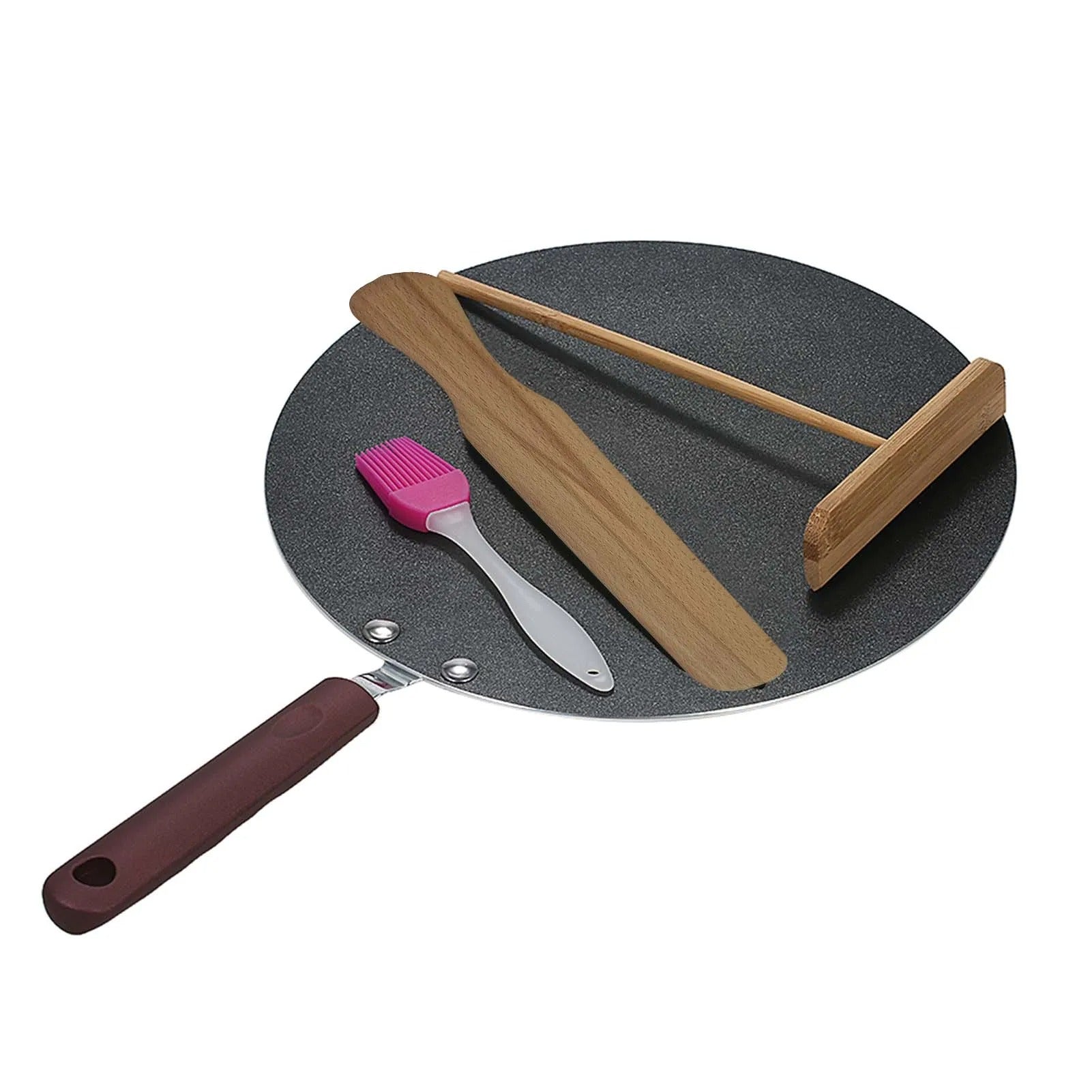 Poêle a Crepe Plate Antiadhésive et Pratique sur fond blanc avec ustensiles de cuisine posés dessus